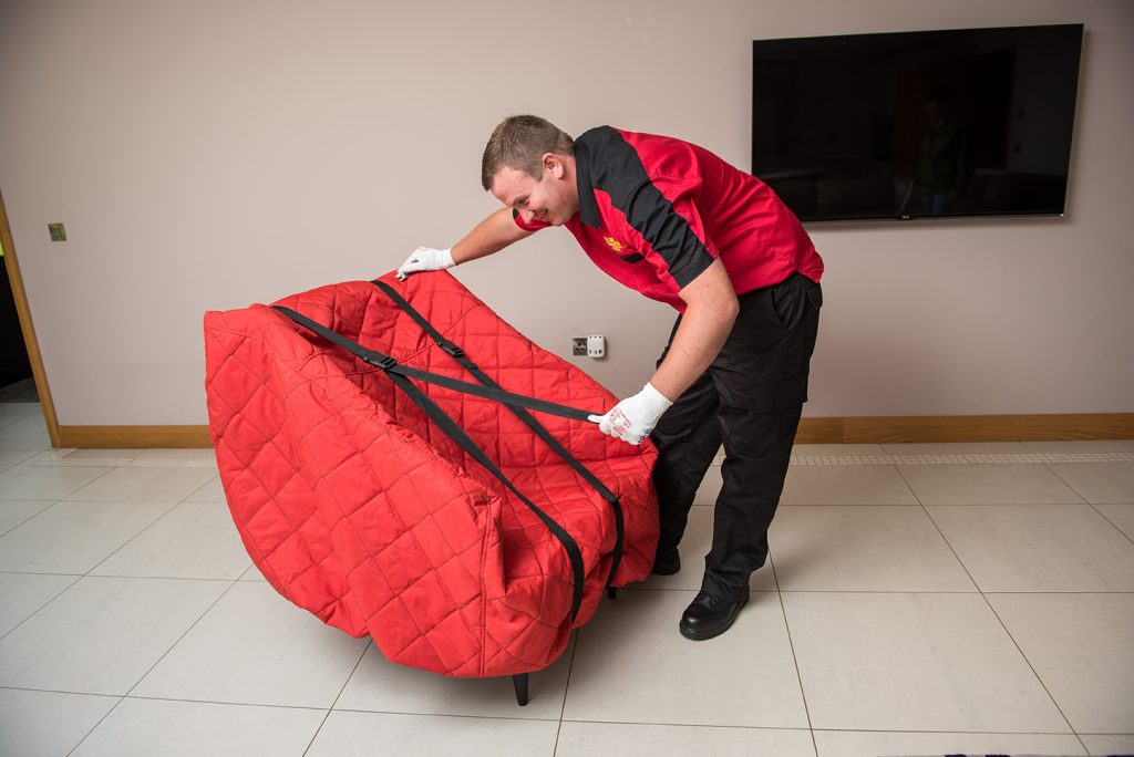 ws-dennison-using-bespoke-strapping-and-carrying-aides-during-furniture-removal